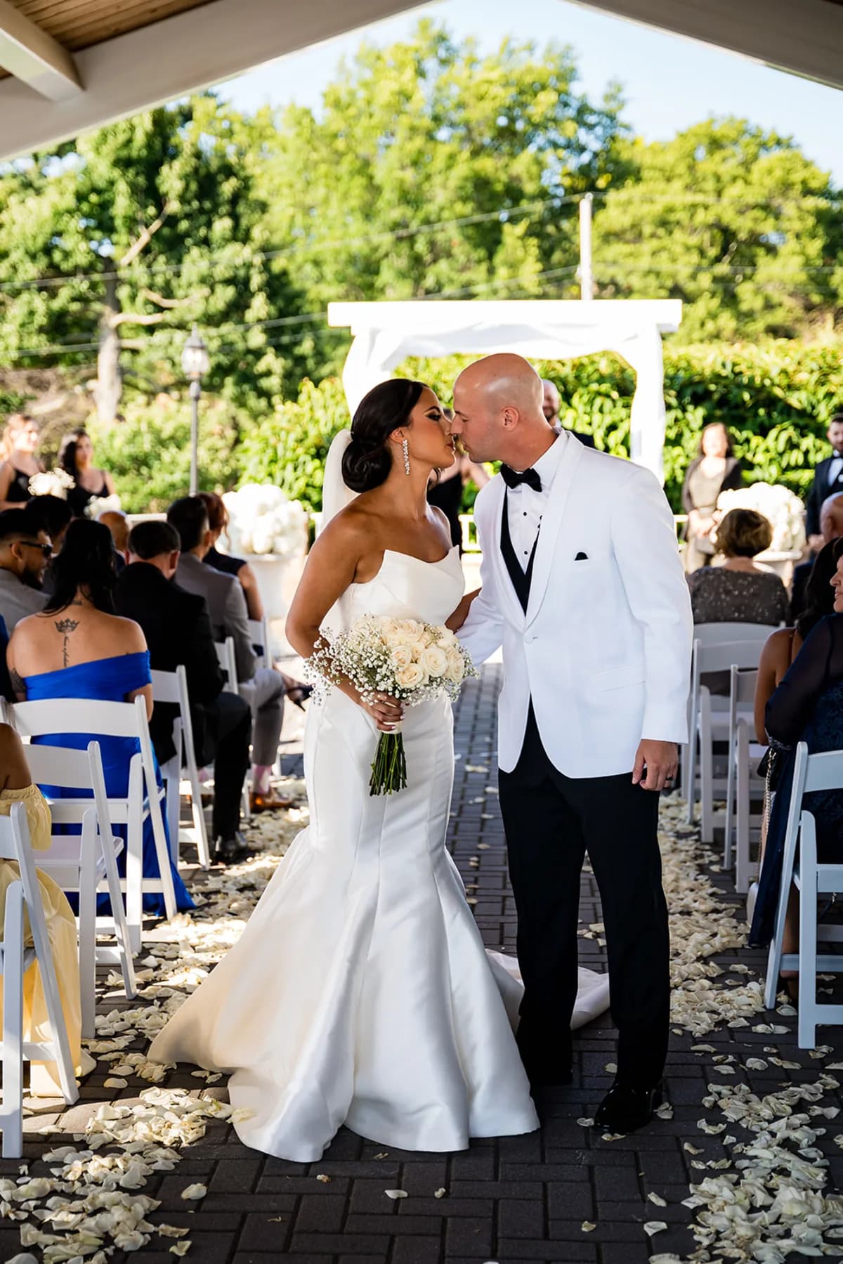 A couple kissing at their ceremony at The Club at Picatinny