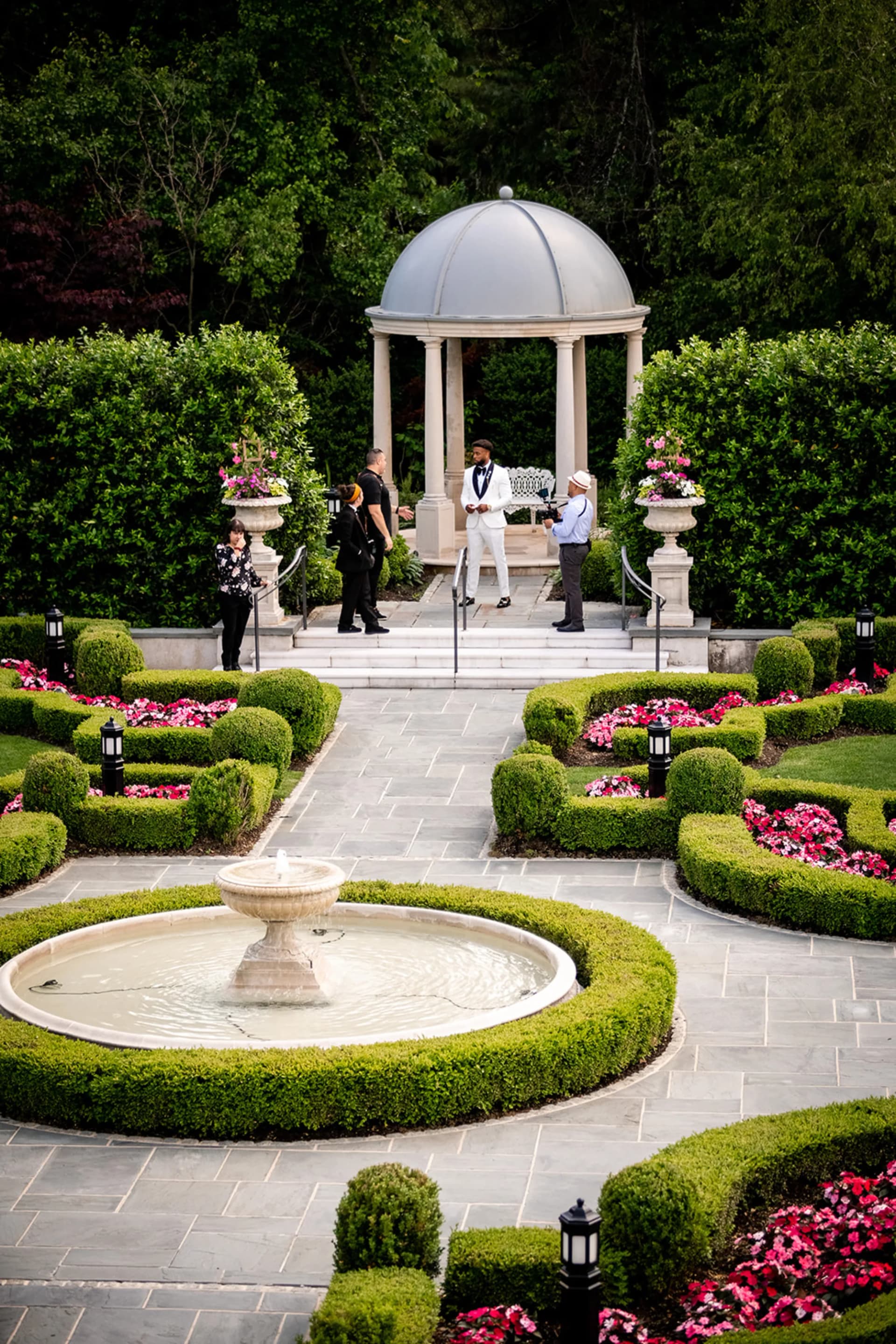 The domed ceremony gazebo and garden fountain at Park Chateau as guests take their seats