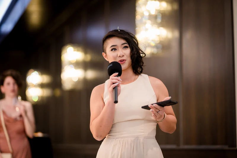A bridesmaid giving a toast at Amanda and Alex’s reception at The Mansion on Main Street