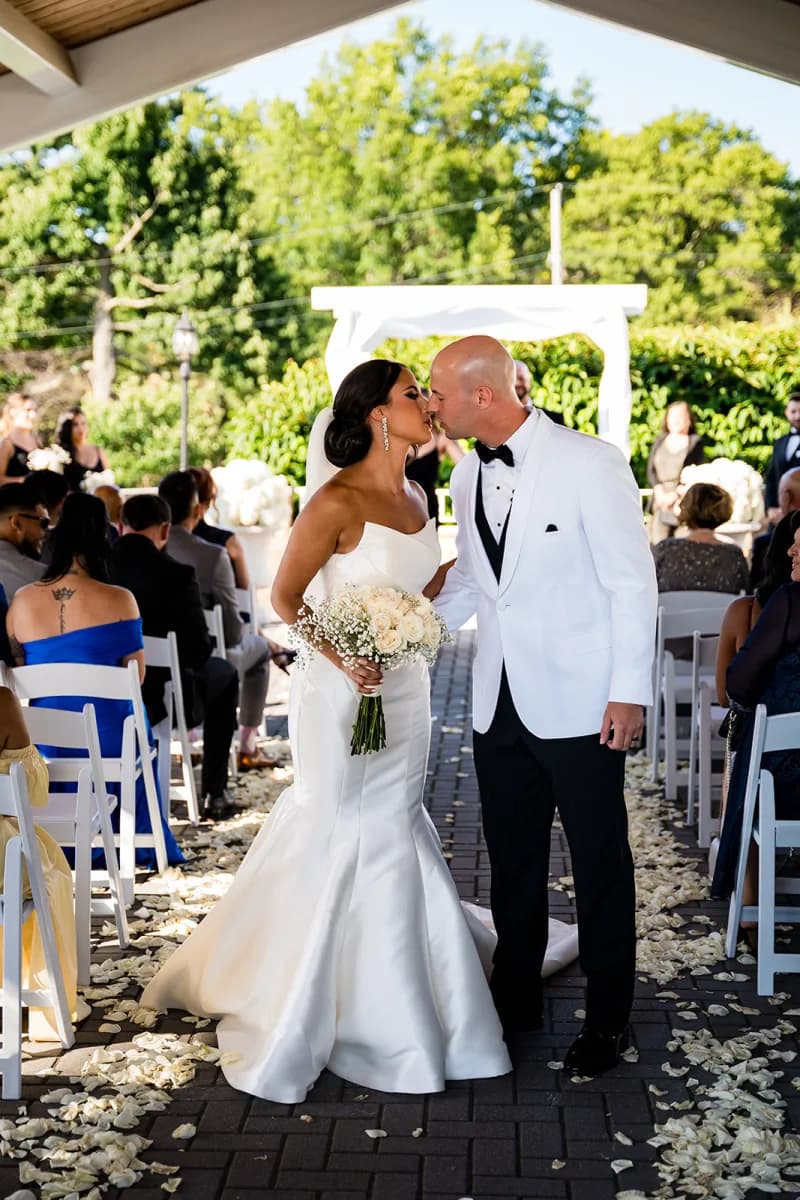 A couple kissing at their ceremony at The Club at Picatinny, Rockaway Township, NJ