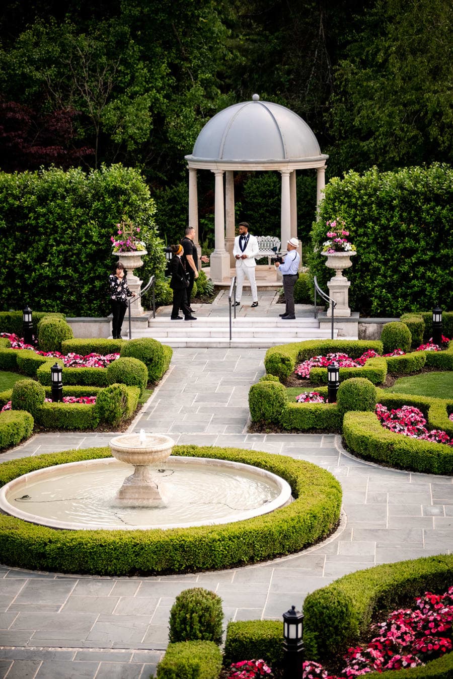 The domed ceremony gazebo and garden fountain at Park Chateau as guests take their seats