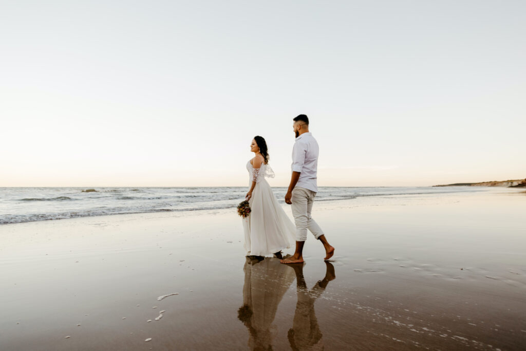 Newlyweds on beach